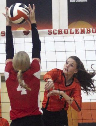 Emmrie Marx bangs an attack off a block attempt by a Lady Ricebird in the first set on Friday at SHS Gym. Sticker Photo By Darrell Vyvjala