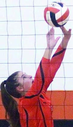 Landry Zapalac sets for one of her 34 assists against El Campo. Sticker Photo By Darrell Vyvjala