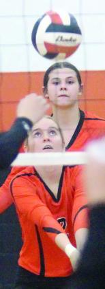 Madison Kunschick digs an El Campo tip in game one on Friday. Sticker Photo By Darrell Vyvjala
