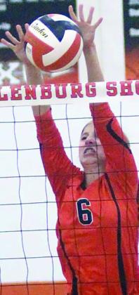 Clara Magliolo goes up to reject an El Campo spike. Sticker Photo By Darrell Vyvjala Sticker Photo By Darrell Vyvjala