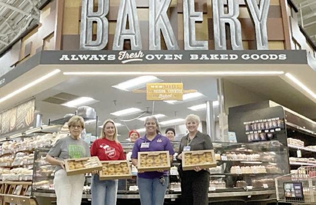 Sho wn with doughnuts donated by La Grange H-E-B for distribution to Fayette County first responders are (from left) Sally Garrett and Krystal Seger, Fayette County Salvation Army Chapter board members who distributed them; Claudia Reyes, HEB bakery manager; and Liz Barta, HEB top store leader.