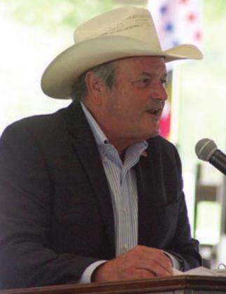 County Judge Joe Weber gives the keynote speech Monday. Sticker Photo By Darrell Vyvjala