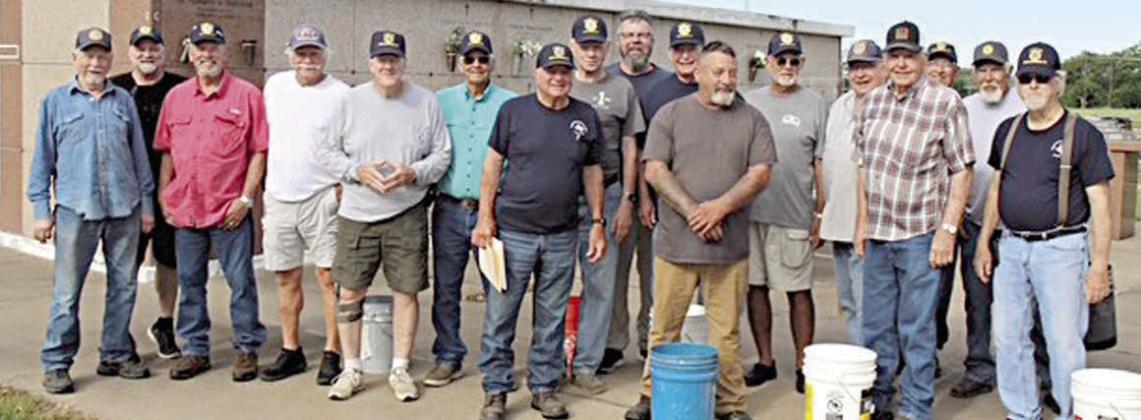 Over 1,200 flags were placed on th e graves of veterans in several area cemeteries, including over 675 flags at the Schulenburg City Cemetery and St. Rose of Lima Catholic Cemetery. In the top photo, a group of volunteers poses with flags at the Schulenburg City Cemetery, and in the bottom photo, volunteers stand in front of the mausoleum at the St. Rose of Lima Catholic Cemetery.