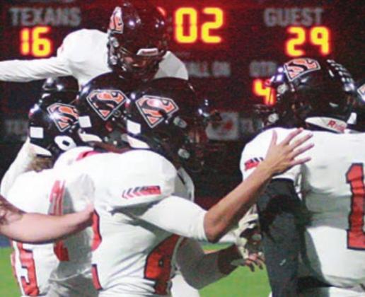 Shorthorn players celebrate their 29-16 bi-district win over Mason, the first playoff victory for the Horns in eight years, which was covered in the Nov. 18 issue.