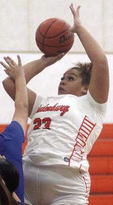 Arianna Vincent scores in the lane on Nov. 21. Sticker Photo By Darrell Vyvjala