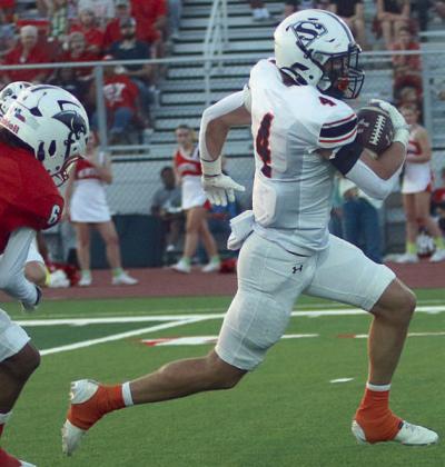 Jayse Janda speeds past a defender en route to a 57-yard touchdown reception in the first quarter. Sticker Photo By Layne Vyvjala