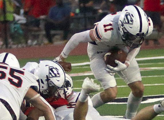 Nick Goode (No. 11) scoops up a Panther fumble in the second quarter. Sticker Photo By Layne Vyvjala