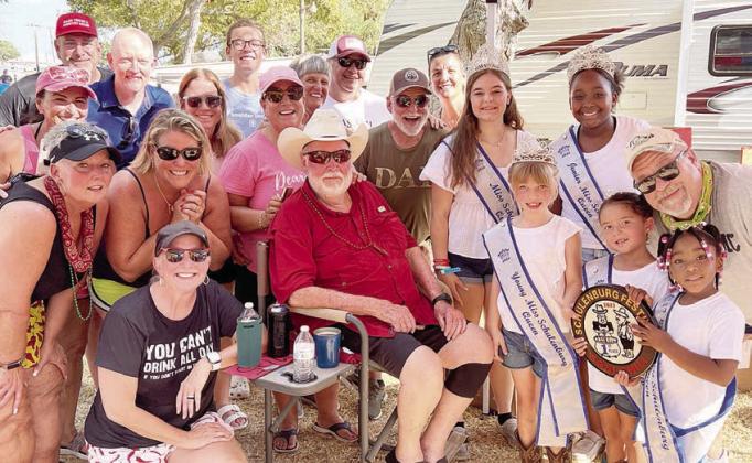 Local Chili 1st Place – “Team Baumgarten” - Jim Baumgarten (seated), who has competed in the Festival cookoff for 40 years, along with family and friends. Also shown presenting the award are Miss Schulenburg and her court. Sticker Photo By Brandt Vyvjala