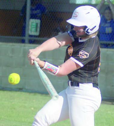 Summer Livingston sends a double to the outfield wall against Louise. Sticker Photo By Darrell Vyvjala