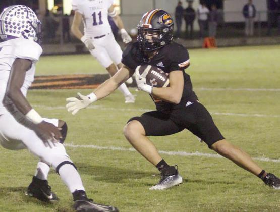 Jayse Janda makes a move to get by a Tiger defender for a 17-yard reception in the second quarter. Sticker Photo By Layne Vyvjala