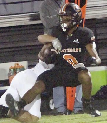 Byron Johnson finishes off a 13-yard reception in the first quarter. Sticker Photo By Layne Vyvjala