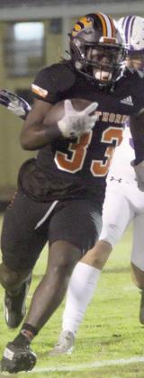 Rodney H Walton sprints past a Thrall player on a 21-yard gain in the first quarter. Sticker Photo By Layne Vyvjala Aaron Janecek finishes off a 7-yard run on the Horns’ first scoring drive. He rushed for 193 yards to bring his regular-season total to 1,326 yards on 179 carries with 22 touchdowns. In addition, his 131 yards passing against Thrall put him over the century mark through the air (1,116 yards, completing 89-of-163 attempts with 11 touchdowns and three interceptions).