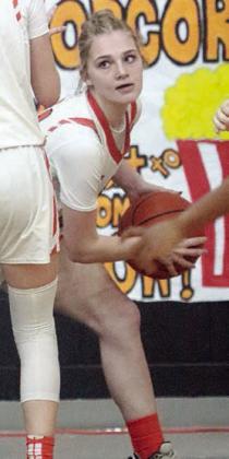 Alana Herzik comes away with a steal against Shiner. Sticker Photo By Darrell Vyvjala