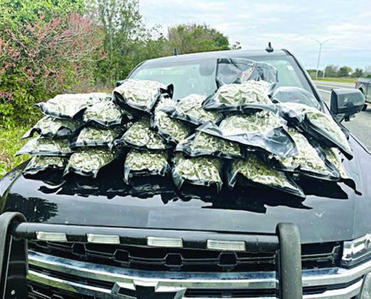 AFTER a traff ic stop on I-10 near Flat onia, 20 sealed bundles of high-grade hydro marijuana were located in a trash bag in the rear cargo area of a 2018 GMC Acadia.