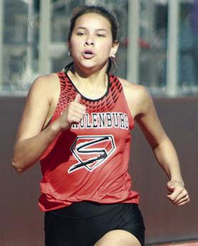 Morgan Steinhauser runs to a second-place finish in the 400-meter dash. Sticker Photo By Darrell Vyvjala
