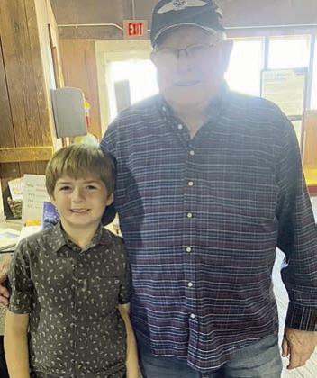 YOUTH PERFORMER Tucker Denham (left) poses with Dennis Muhlstein (right).