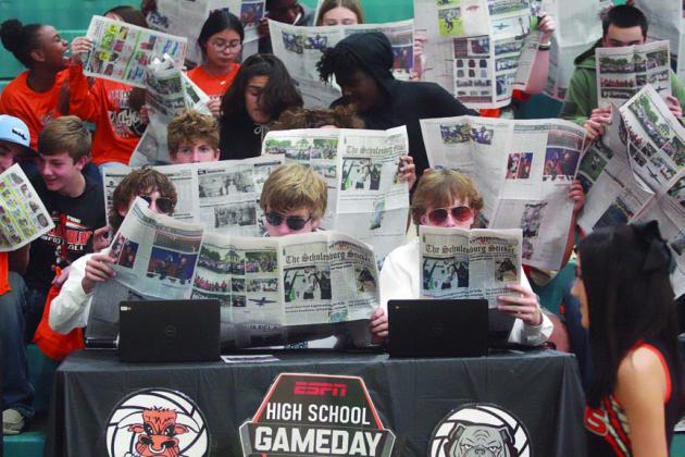 Schulenburg High students show their disinterest with the introduction of Three Rivers’ players by perusing last week’s issue of the Sticker. The section included the “ESPN High School Gameday” broadcast team of (front, from left) Cooper Demel, Brycen Schramek, and Kenny Schramek. Sticker Photo By Darrell Vyvjala