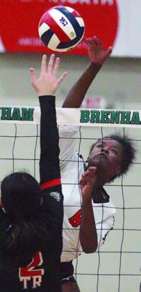 Jessalyn Gipson sends a kill over a Lady Bulldog in the first set. Sticker Photo By Darrell Vyvjala Sticker Photo By Darrell Vyvjala