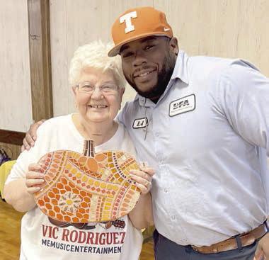 New member Mary Jim Morrison (left), shown with E.J. Jones (right), received a mosaic made by Stephanie Shroyer.