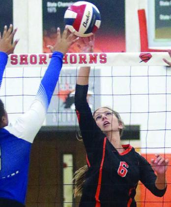Clara Magliolo gets a tip past a Lady Bulldog blocker in the first set of the Lady Horns’ first tourney matchup vs. Yoakum. Sticker Photo By Darrell Vyvjala