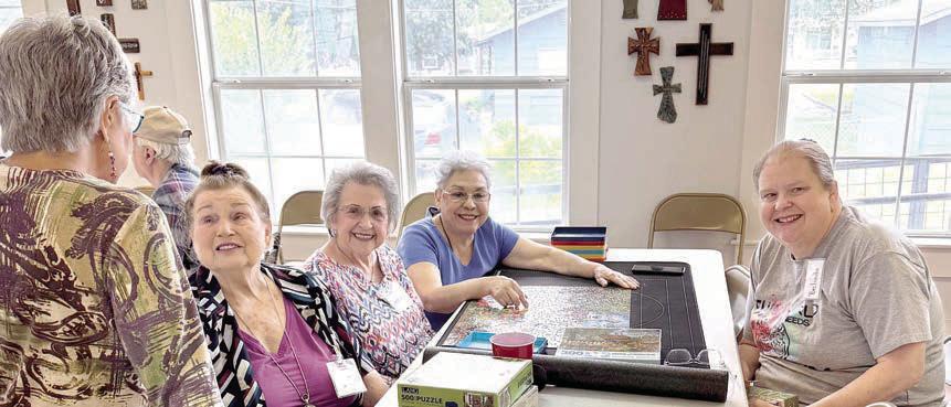 The ladies of Flato nia finished another puzzle – they may be practicing for the puzzle-building contest planned for early fall. Shown are (from left) Julia Webster talking to Jo Brunner, Jeanette Zouzalik, Isabel Martinez and Belinda Newman. Those who enjoy puzzles are invited to start forming a team of four, and watch for the big date. What should be the prize? – it’s a puzzling dilemma!