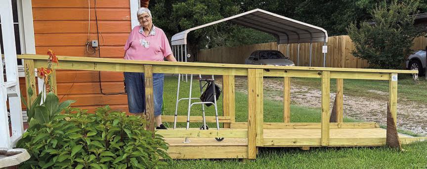 Cynthia Meyer is shown with her new ramp constructed by Texas Ramp Project. A representative from the organization gave a presentation at Senior Connections recently, and within a month’s time Meyer had the added safety when getting in and out of her home.