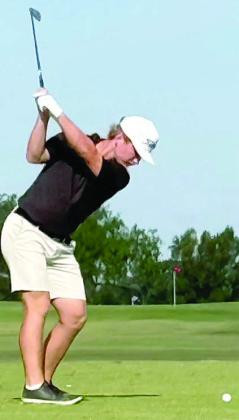 Brycen Schramek, the lone senior on this year’s golf team, tees off on a par-3 at the regional tournament.