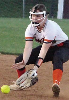 Shortstop Haylie Goode scoops up a Lady Bulldog ground ball for an out Friday night. Sticker Photo By Darrell Vyvjala