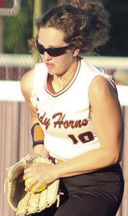 Grace Schramek secures a fly ball in shallow right field Friday. Sticker Photo By Darrell Vyvjala
