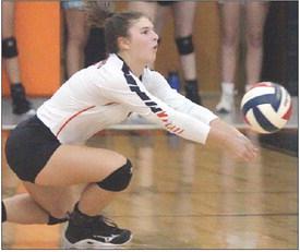 Landry Zapalac goes down to dig a Pirette attack last Friday. Sticker Photo By Darrell Vyvjala