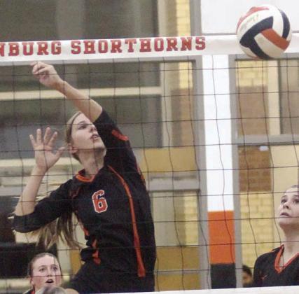 Clara Magliolo tips a ball over in game four of the Lady Horns’ win over Weimar. Sticker Photo By Darrell Vyvjala