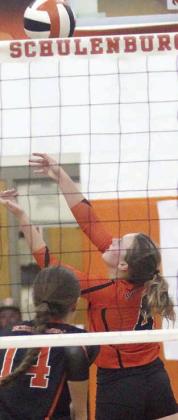 Avery Helms saves a ball in the back row during game five last Tuesday. Sticker Photo By Darrell Vyvjala