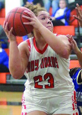 Arianna Vincent secures a rebound against Louise. Sticker Photo By Darrell Vyvjala