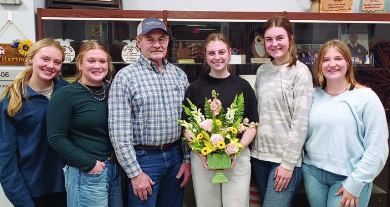 Floral design and shop show results was part of the program given by Schulenburg FFA officers at the Young Farmers meeting. Shown are (from left) Keeley Warnken and Haley Schramek, FFA’ers; Mark Vecera, Young Farmers president; and Kaylee Beyer, Madyson Holub and Kyrroll Prihoda, FFA’ers.