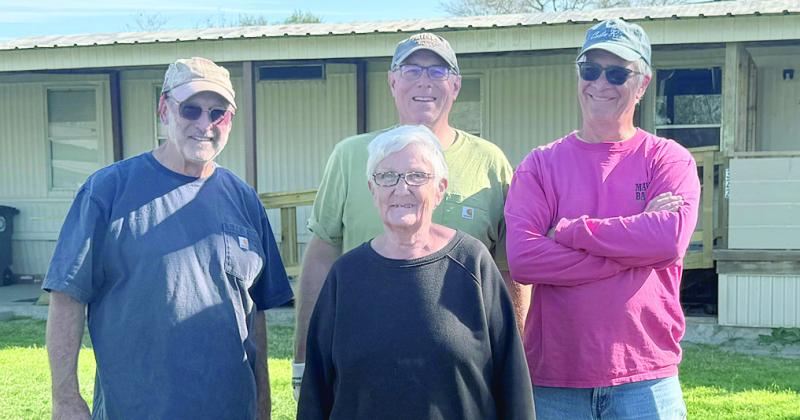 An Aging in Place project was recently completed by Fayette County Habitat for Humanity to benefit Bennie Lou Liere (front). Also shown are Habitat volunteers (back, from left) Steve Hardin, Matt Holdeman and Doug Elliott.