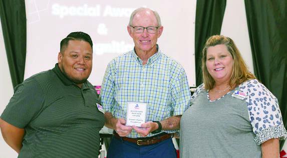 2025 Milestone Partner Award recipient was Stanzel Family Foundation, represented by Bob Stanzel (center). Representing PAT were Josue Rivas (left), development director, and Karen Hoskins (right), PAT program director,