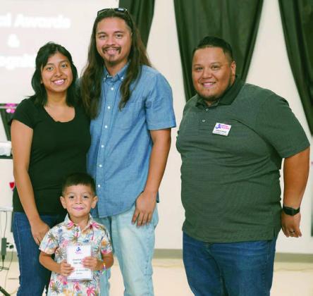 2025 Family of the Year award recipients were (from left) Jennifer Garza, Elijah Garza and Joe Garza. Also shown is Josue Riva (right), PAT development director.