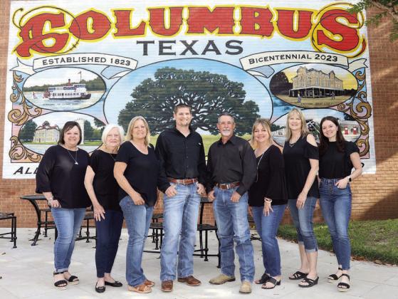 Double G Realty Group – (from left) Michelle Courtney, Linda Woodward, Penny Henske, Dustin Helmcamp, Troy Goolsby, Jolyn Goolsby, Melanie Appelt and Mary Courtney.