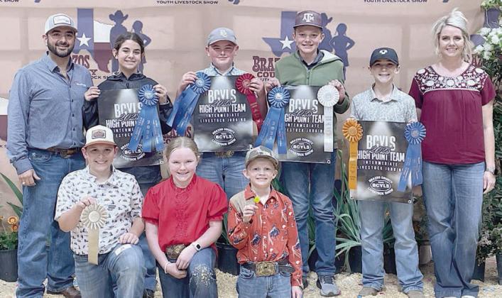 Fayett e County 4-H teams competing in the Brazos County Youth Livestock Judging Contest were (front row, from left) Hudson Holub, Abigale McBride and Joe Carrales, fourth place junior team; (back row) coach JoJo Carrales; Adalyn Carrales, Abraham McBride, Holden Holub and Crockett Guenther, champion intermediate team; and coach Kaci Carrales.