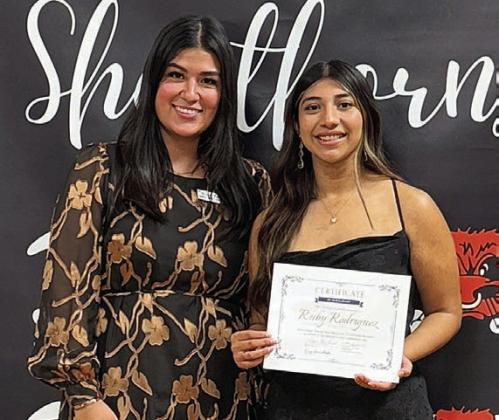 Ruby Rodriguez (right), Schulenburg High graduate, was presented the Ginger Stanzel Bosl Memorial Scholarship by Melanie Ramirez (left), Stanzel Family Foundation program director.