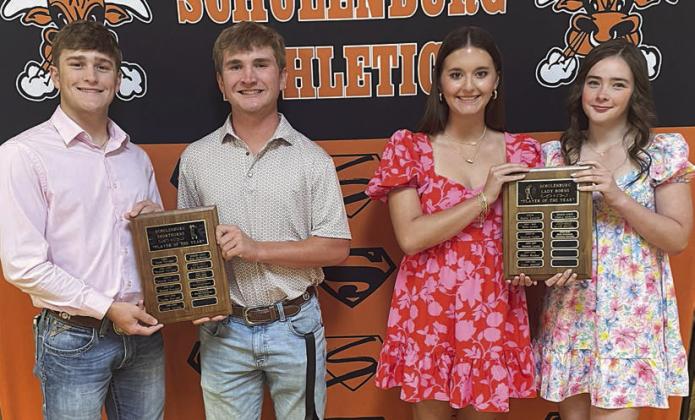 GOLF – (from left) Reid Janda and Brycen Schramek, Boys’ Players of the Year; and Molly Rorschach and Cheyenne Henneke, Girls’ Players of the Year. Sticker Photo By Darrell Vyvjala