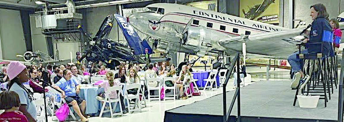Stepping up to the microphone to ask a question during the professional panel discussion was Ava Boston (foreground second from left). Panelists were Captain Michelle Boeding, B-777 captain, United Airlines; Maria “Ma Jo” Perdomo Cuevas, executive director, Million Air; Sarah “Sassie” Dubbley, CEO and co-founder of Venus Aerospace; and Dr. Bonnie Dunbar, former NASA astronaut and Professor of Aerospace Engineering, Texas A&amp;amp;M University.