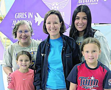 panelist Sarah “Sassie” Duggleby (center), cofounder of Venus Aerospace, is shown with Emmalyn Pekar (front left), Ella Pekar (front right), Cynthia Fogleman (back left) and Melanie Ramirez (back right).
