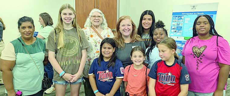 Lone Star Flight Museum senior director of education and community outreach Ann Hobing poses with the group. Shown are (front row, from left) Maria Camacho, Vyvynne Friemel, Rebecca Camacho, Emmalyn Pekar, Ella Pekar, Jade Williams, (back row) Ginger Friemel, Hobing, Melanie Ramirez and Ava Boston.