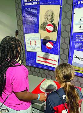 At THE Bernoulli Principle demonstration are Jade Williams (left) and Ella Pekar (right).