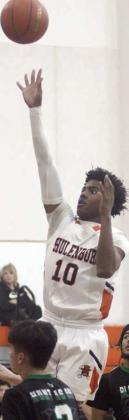 Da’Terrion Houston hits a floater  in the lane in the first half against the  Bobcats. Sticker Photo By Darrell Vyvjala
