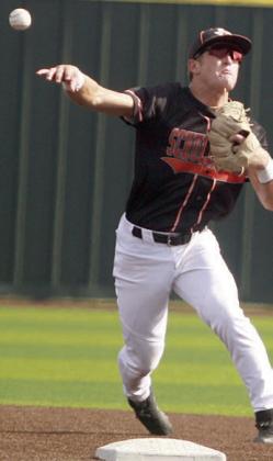 Shortstop Reid Janda fires to first after fielding a ground ball behind second base. Sticker Photo By Darrell Vyvjala