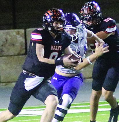 Owen Brenek uses a block from Jayden Olmos to get free for a 56-yard run in the first quarter. Sticker Photo By Layne Vyvjala