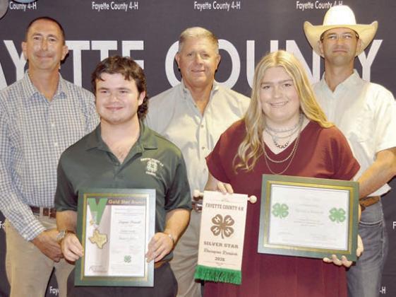 Gold &amp; Silver Star Award Winners – (front row, from left) Gold Star, Logan Poncik, and Silver Star, Rheagan Karisch. Presenters (back row, from left) Commissioners Jason McBroom, Harvey Berckenhoff and Clint Sternadel.