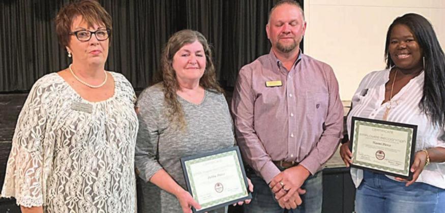 Wagner and Zapalac give special awards to Chamber employees Debbie Preece (second from left) and Naomi Pierce (right). Sticker Photo By Dale Manning